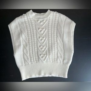 White sweater vest